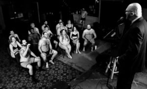 Chad Riden on stage at The East Room in Nashville facing an audience in their underwear